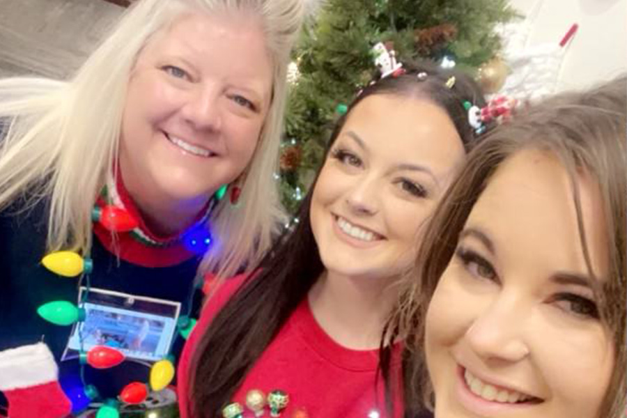 Spokane Valley, WA Insurance - Empire Insurance Brokers Team Smiling and Taking a Selfie in Front of a Christmas Tree
